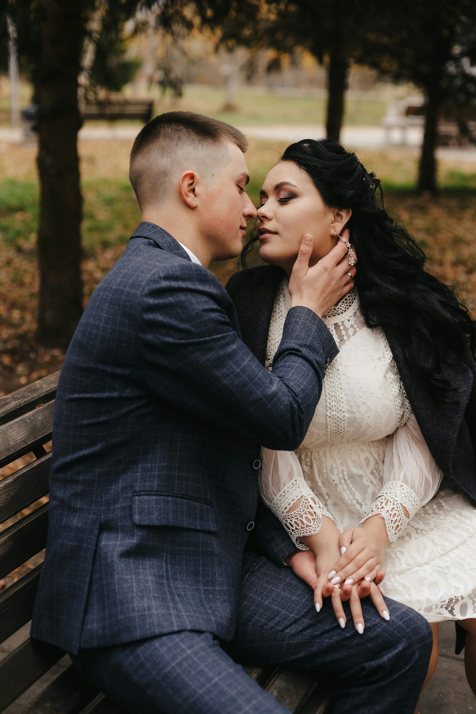 a man and woman sitting on a bench